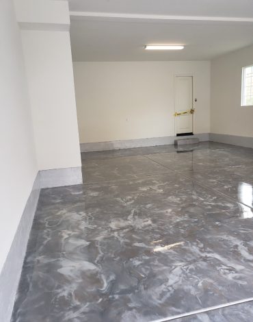 Metallic epoxy garage floor coating with gray swirl finish, South Florida